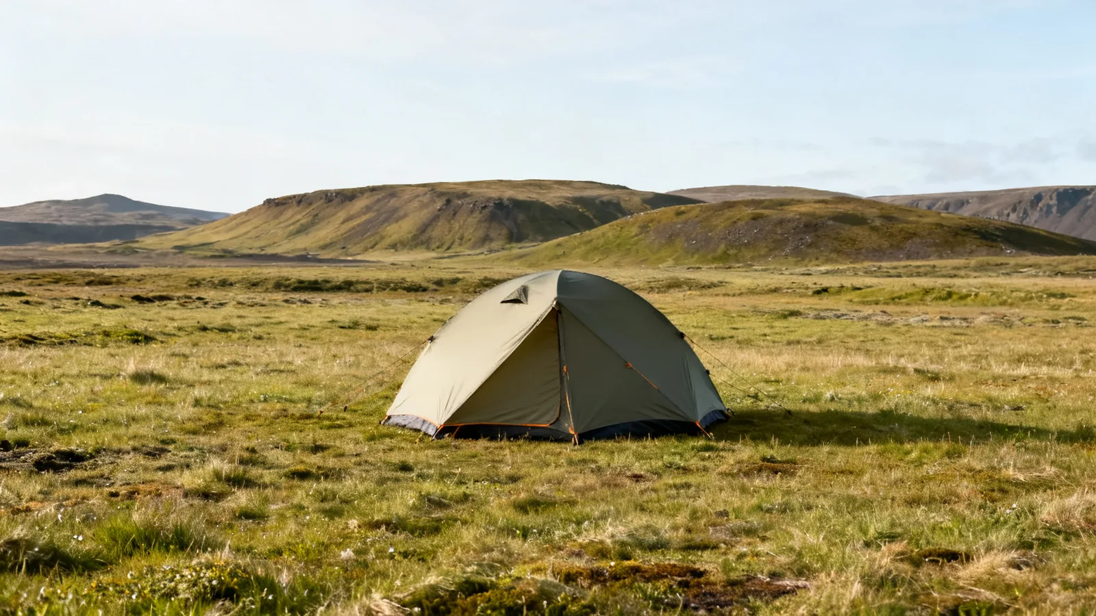 Generic tent on a rural Icelandic grass field